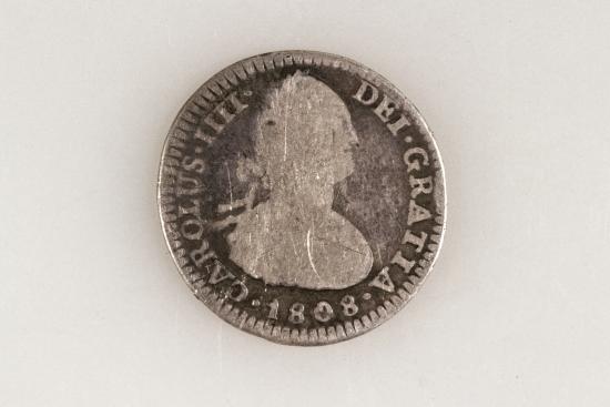 Moneda española de 1808, con la silueta del rey Carlos IV